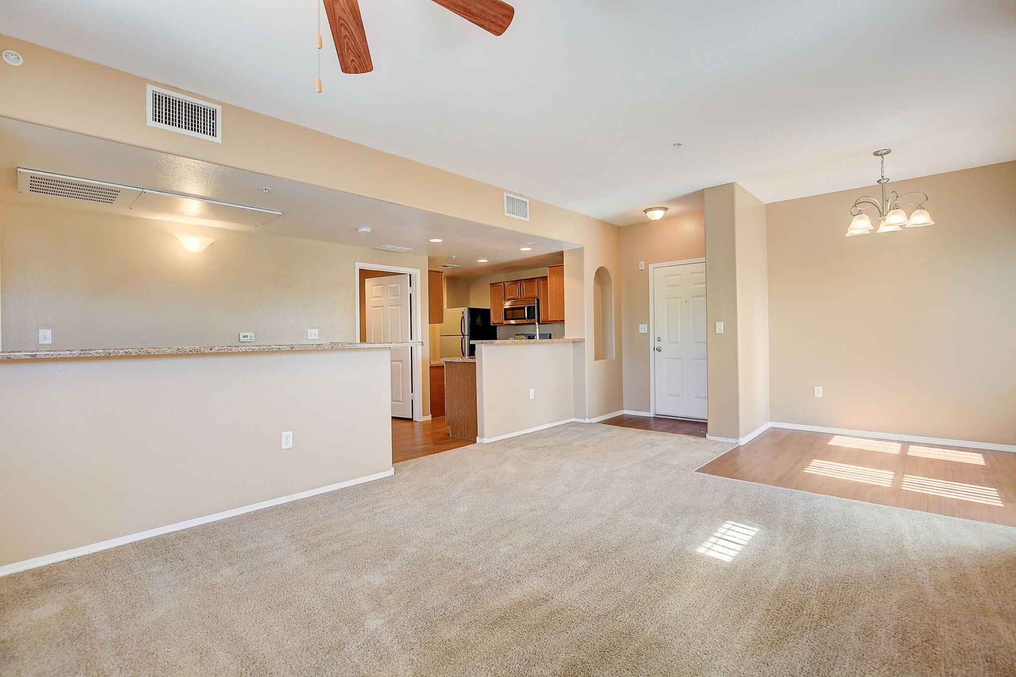 Apartment Livingroom Dining Area And Front Kitchen View